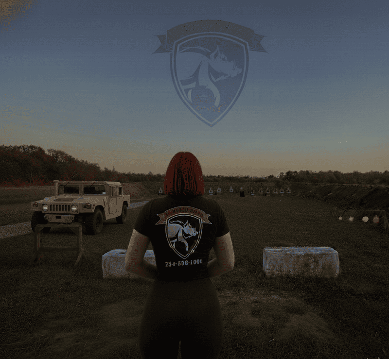 Person at Armored Boar outdoor shooting range during sunset